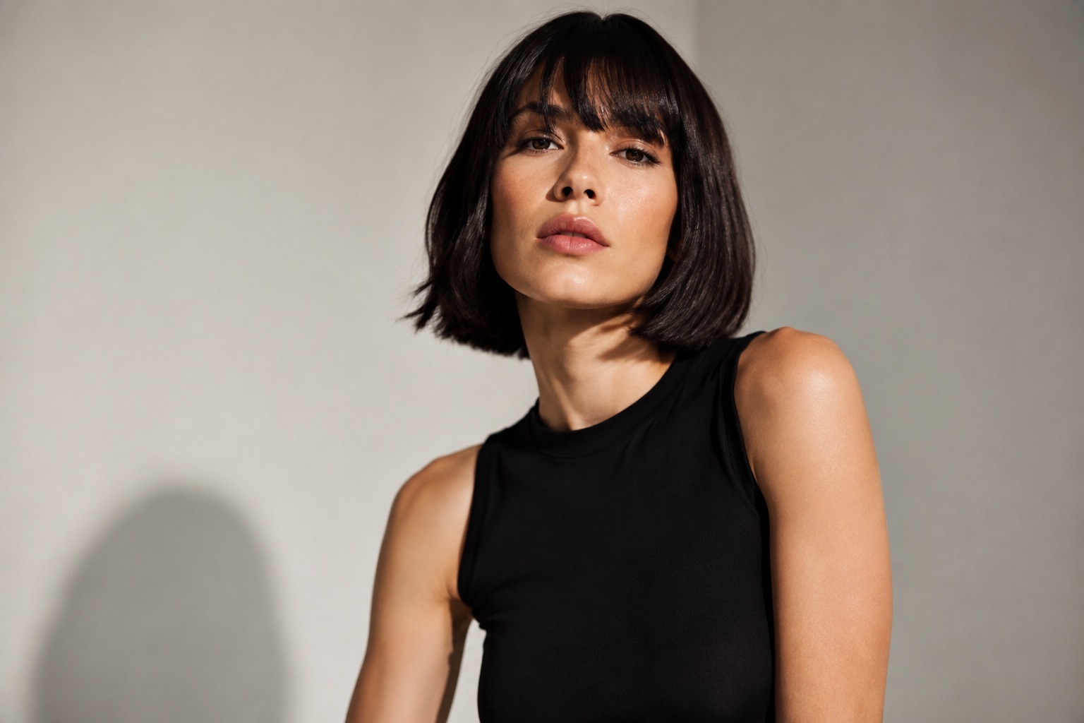 AI-generated concept: Editorial portrait of a woman with a dark bob